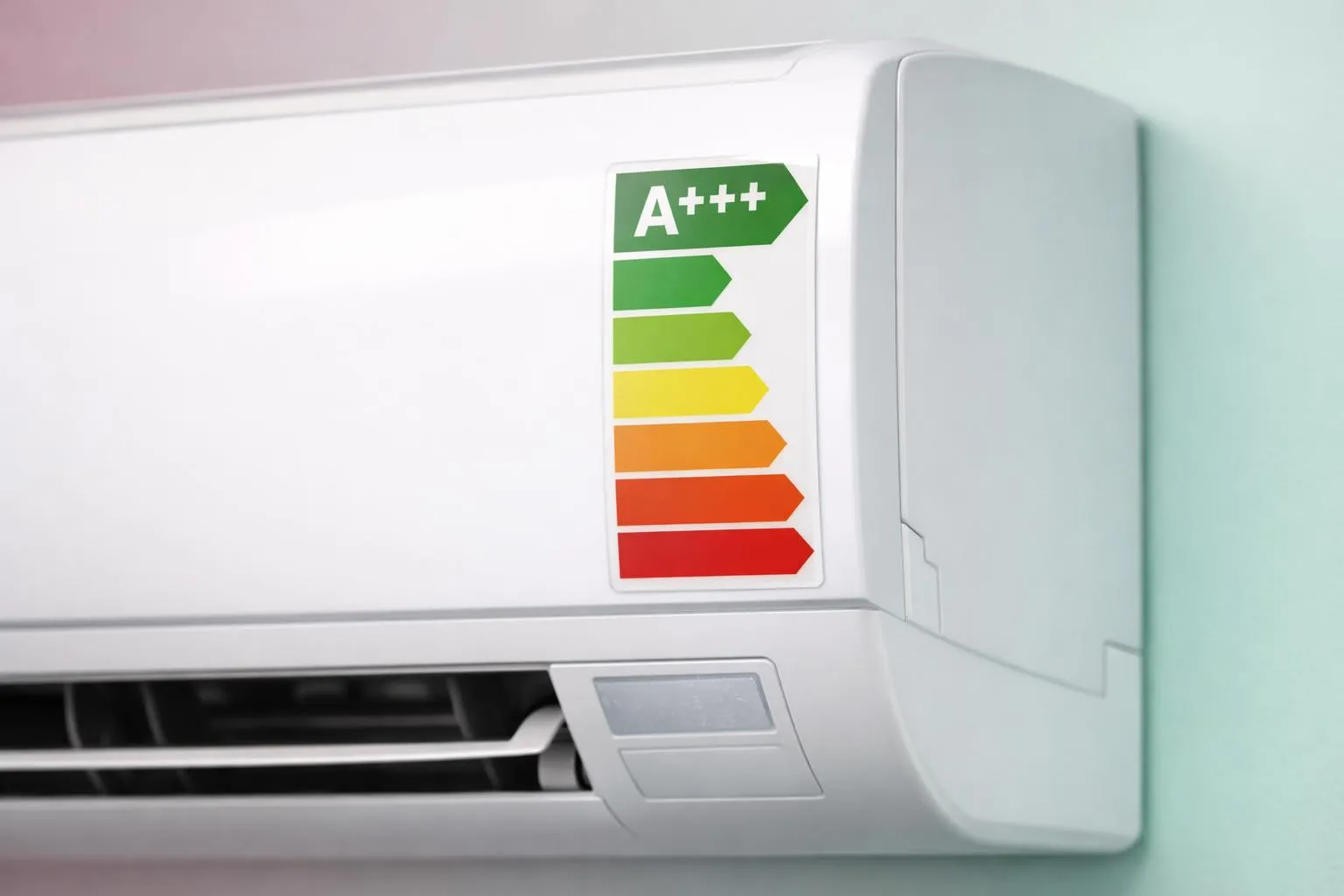 Close-up photograph of a modern wall-mounted air conditioner unit displaying a clear energy efficiency label with A+++ rating, SEER and SCOP values visible on white label, technical specifications shown in crisp detail, professional product photography lighting, no text overlay or graphics