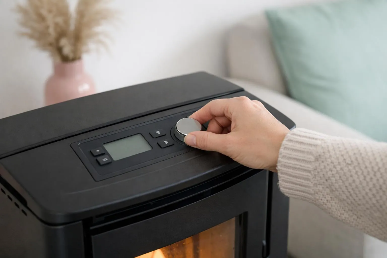 Black printer with control panel and hand adjusting settings.